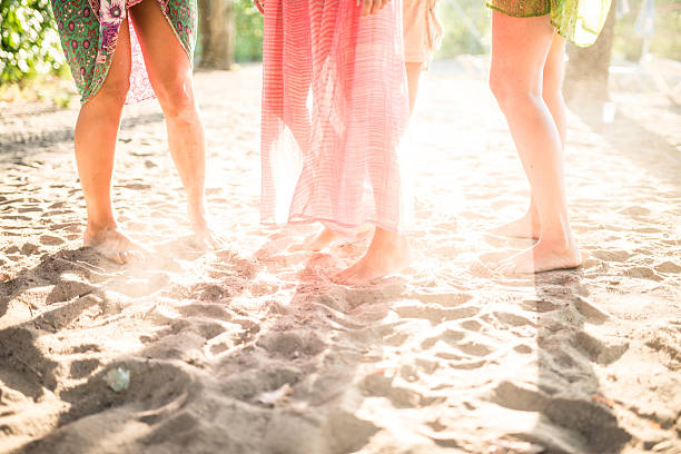 istock Friends enjoy sunset on the beach 534202552