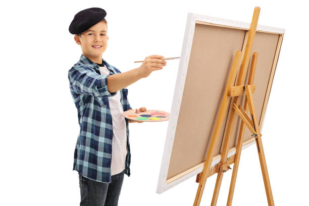 istock Cute little boy painting on a canvas 534207882