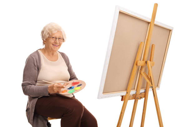 istock Mature lady mixing colors on color palette 534209178