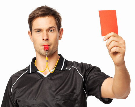 Portrait of confident soccer referee showing red card while whistling isolated over white background. Horizontal shot.