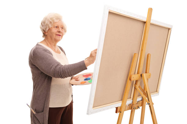 istock Senior woman painting on a canvas 534209534