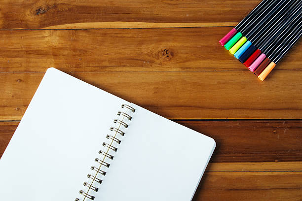 istock Blank notepad with colorful pen on office wooden table 534210294