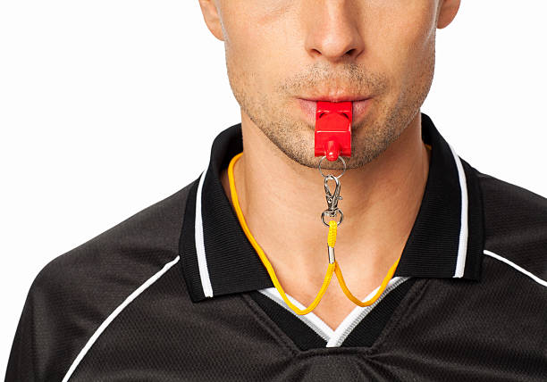 istock Midsection Of Soccer Referee With Whistle In Mouth 534210730