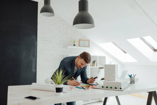 istock Businessman Coloring Book In His Office. 534210758