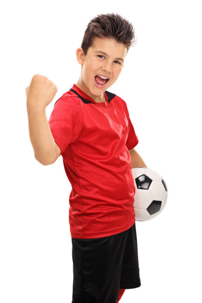 junior con pugni rimasta giocatore di football - little boys people indoors soccer foto e immagini stock