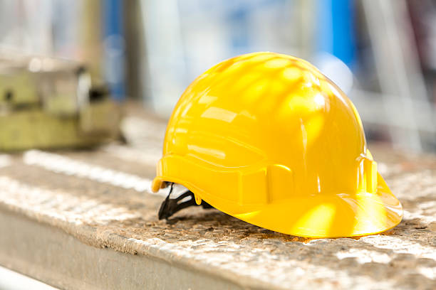 istock Yellow safety helmet slanted on scaffolding 534211280