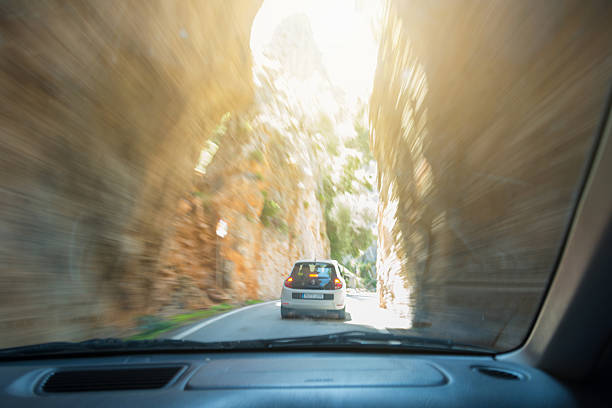 Sa Calobra, Spain - April 16, 2016: Cavall Bernat, Mallorca Serra de Tramuntana, Sa Calobra. Famous constriction at a street in Sa Calobra. A car is driving carefully trough this part named Cavall Bernat. Other traffic members must wait. The Sa Calobra is a very famous serpentine street in Mallorca