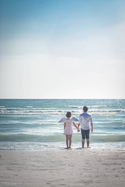 istock Couple holding hand on a tropical beach at beach. 534211970