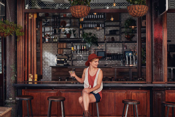 istock Attractive young woman sitting alone at a cafe 534212538