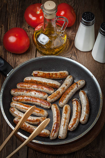 istock Fried white sausages in a cast iron skillet. 534213406