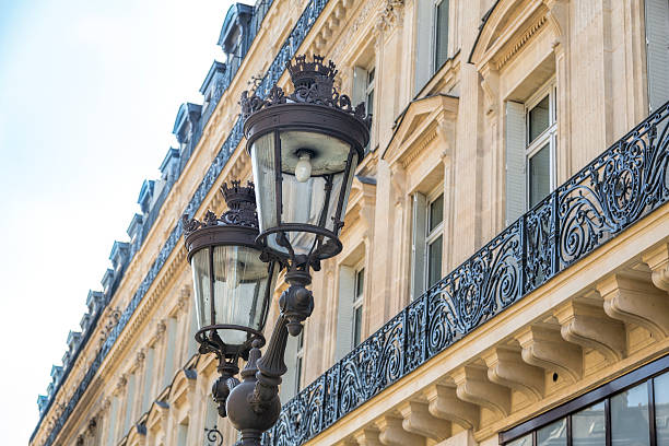 istock Paris facade with iron balconies and oldfashioned sstreet lamp 534214058
