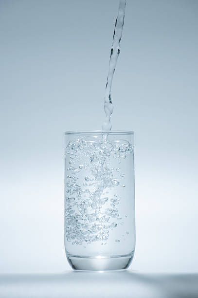 istock water splashing from glass isolated on white background 534214168