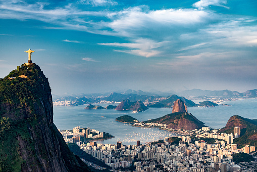 Aerial view of Rio De Janeiro. Corcovado mountain with statue of Christ the Redeemer, urban areas of Botafogo, Flamengo and Centro, Sugarloaf mountain.