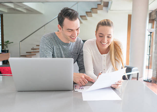 istock Couple paying bills online at home 534216014