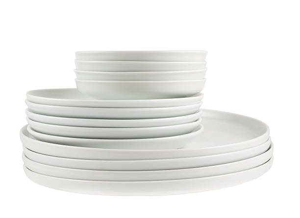 istock Pile of clean white dish plates isolated 534216058