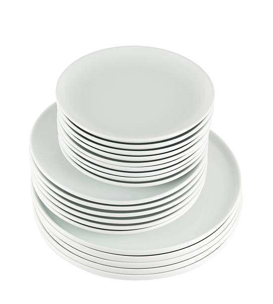 istock Pile of clean white dish plates isolated 534216196