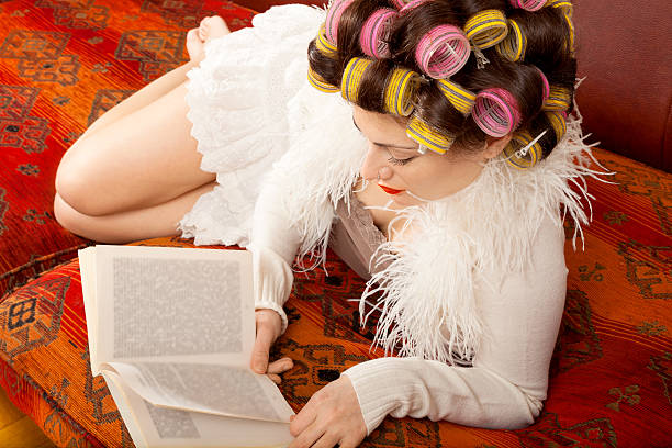 istock woman reading on the couch 534217689