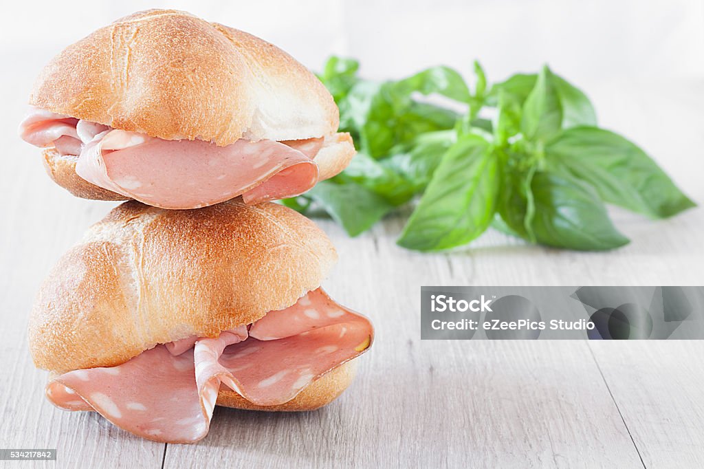 Sandwiches Sub Sandwiches sub with buns and mortadella slices. Mortadella Stock Photo