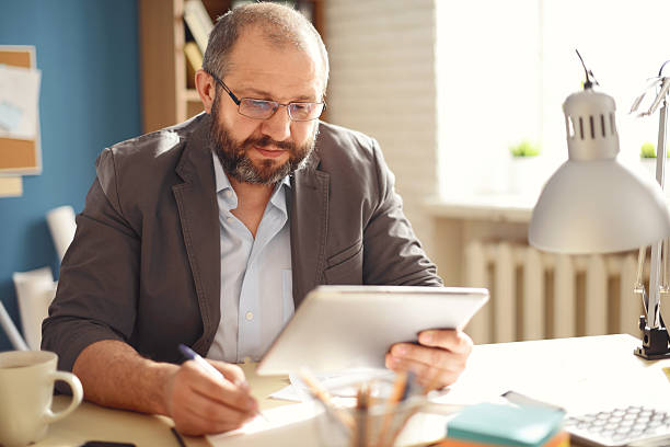 istock Mature Adult man working in the office 534218270