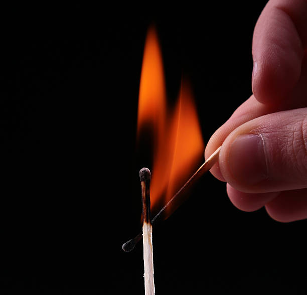 istock Ignition of a match, with smoke on dark background 534219679
