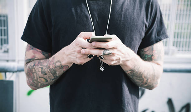 istock Hands holding a smartphone on the street 534220534