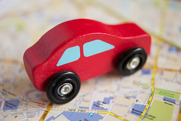 istock Red Wooden Toy Car On Road Map 534220755