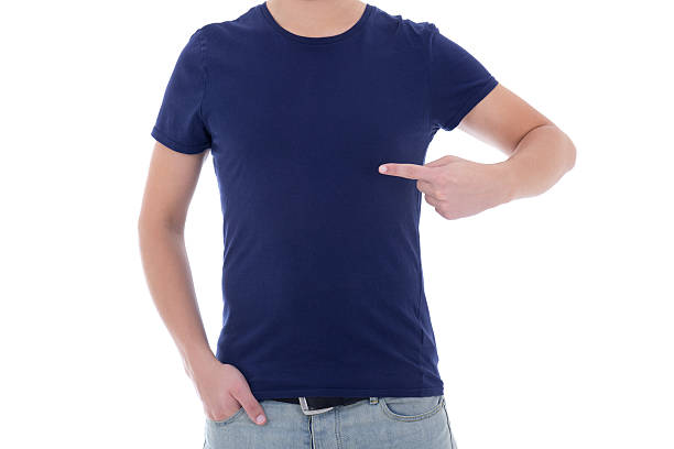man in blank blue t-shirt pointing at himself stock photo