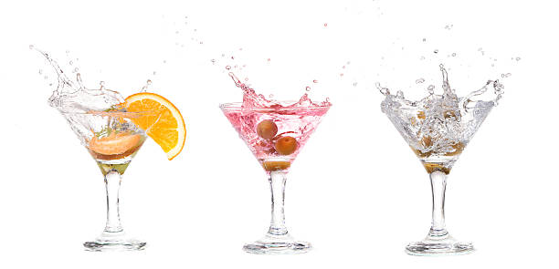 istock Splash from olive in a glass of cocktail, isolated 534221815