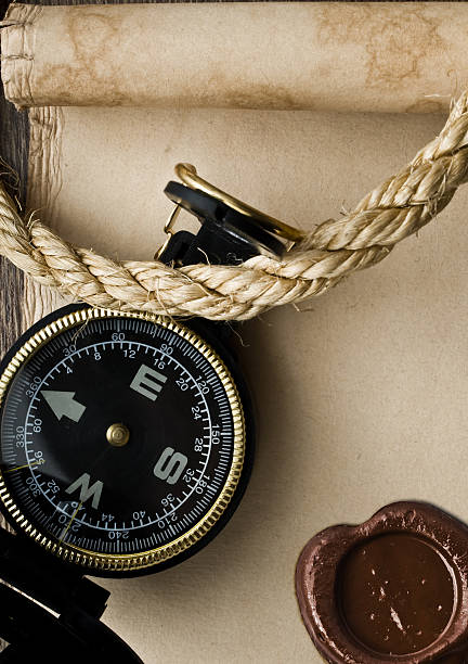 istock compass and rope on old paper background 534224883