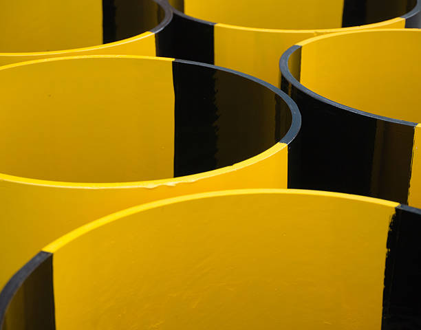 abstract yellow and black pipes hand-painted black and yellow tubes rustproof stock pictures, royalty-free photos & images