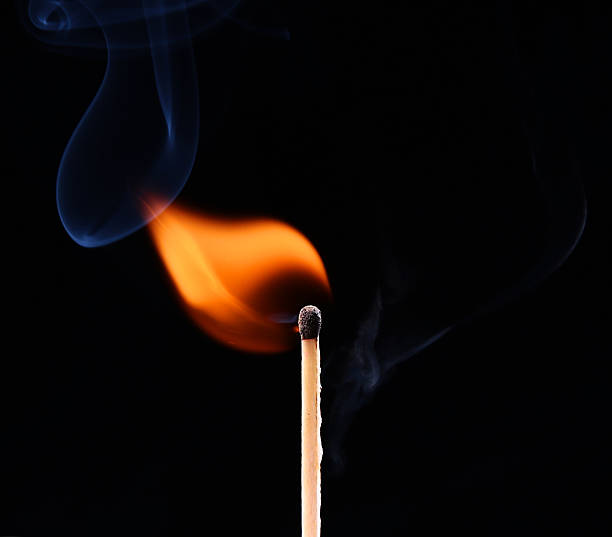 istock Ignition of a match, with smoke on dark background 534227237