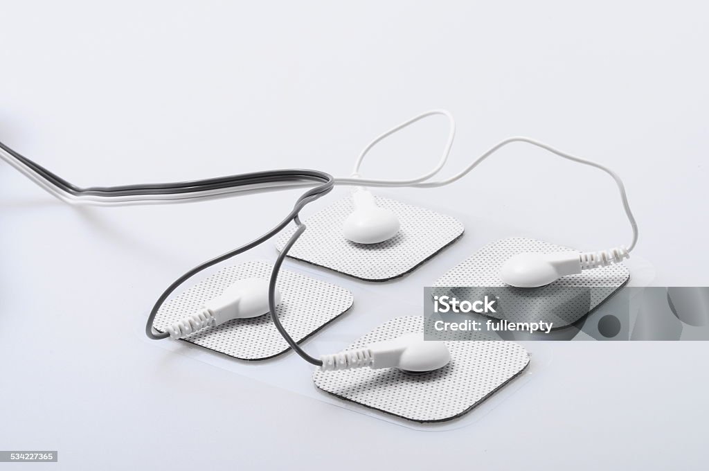 electrodes and electrical stimulation device Close up of white electrodes and electrical stimulation device Electrode Stock Photo