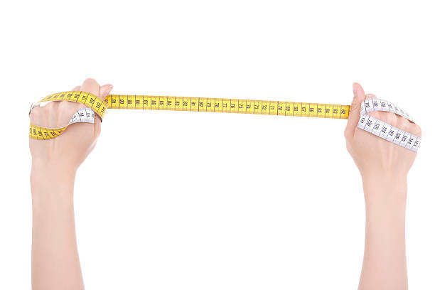 istock hands holding a measure tape isolated on white background 534227629