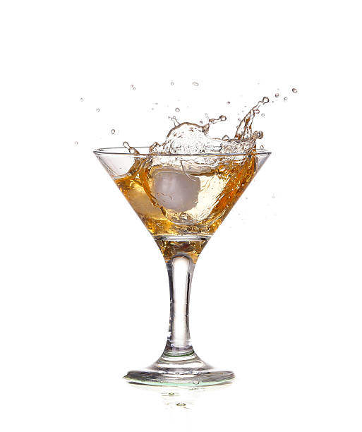 istock alcohol cocktail with splash of ice isolated on white 534264411