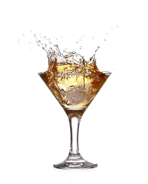istock alcohol cocktail with splash of ice isolated on white 534264431