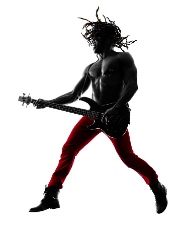 one african man guitarist bassist player playing in studio silhouette isolated on white background