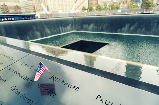 New York, United States - September 12, 2013: NYC's 9/11 Memorial at World Trade Center Ground Zero seen on September 12, 2013. The memorial was dedicated on the 10th anniversary of the Sept. 11, 2001 attacks.