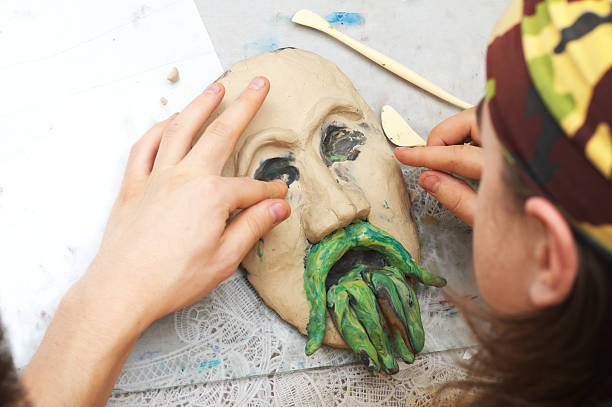 istock Sculpting plasticine form of face with moustache 534272867