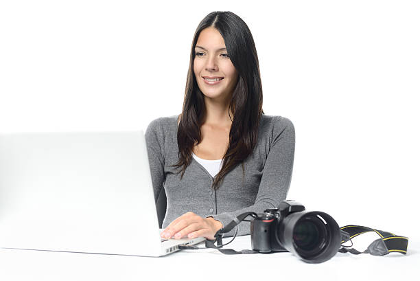 istock Photographer smiling in satisfaction at her images 534273219