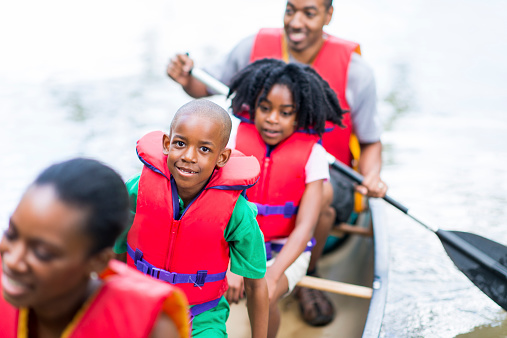 African American family canoeing.