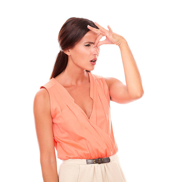 istock Lovely female with hand on head gesturing headache 534275873