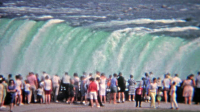 1965: Crowd observing flood water levels at Niagara Falls.