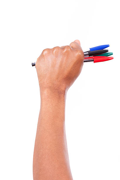 woman's hand holding pencils