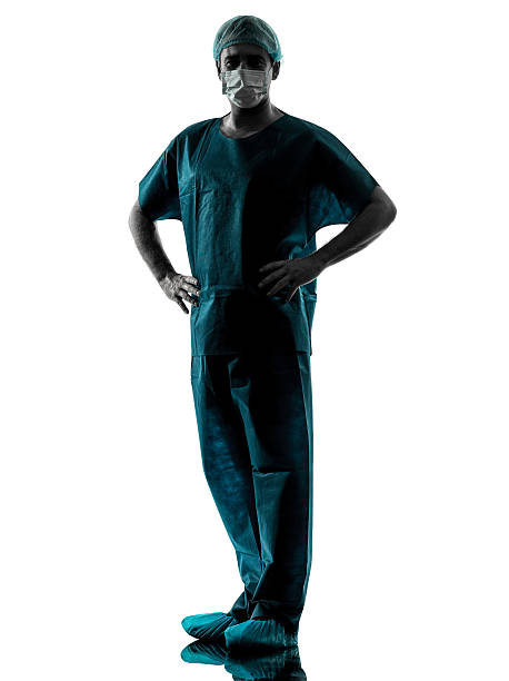 istock doctor surgeon man with face mask full length silhouette 534304081