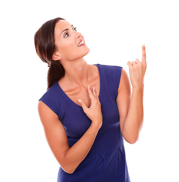 istock Beautiful young girl pointing up and looking up 534304969