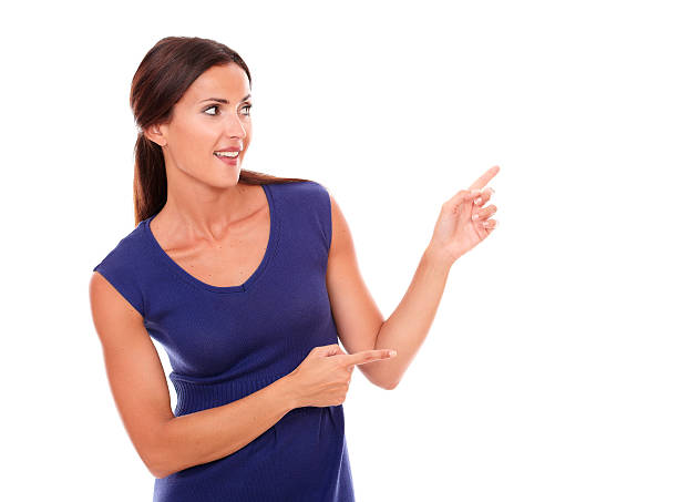 istock Beautiful girl pointing to her left 534304985