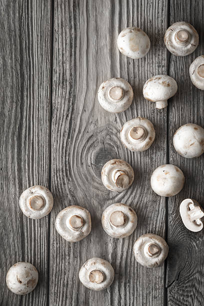 istock Champignon on the old wooden table vertical 534305262