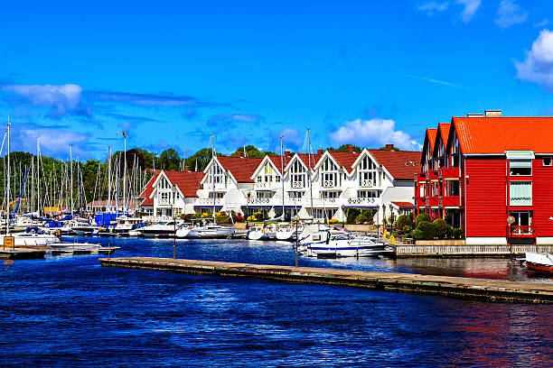 istock Harbor with few boat and white houses, Norway 534305323