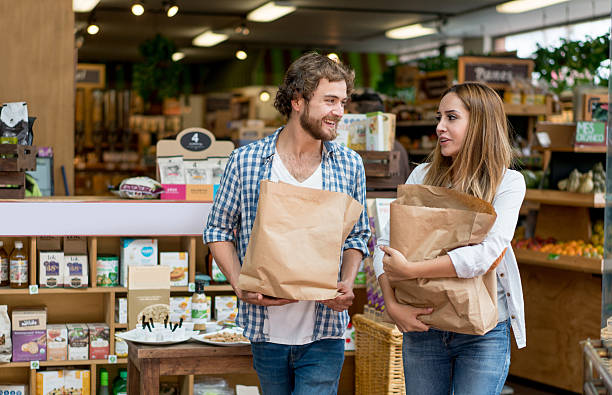 happy couple grocery shopping - organic bag bildbanksfoton och bilder