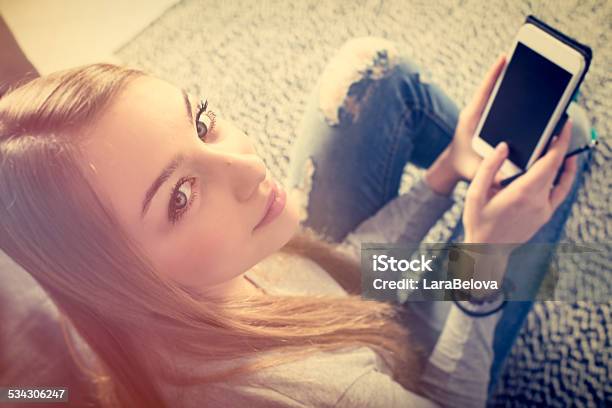 Teenage Girl With Smart Device Stock Photo - Download Image Now - 18-19 Years, 2015, Adult